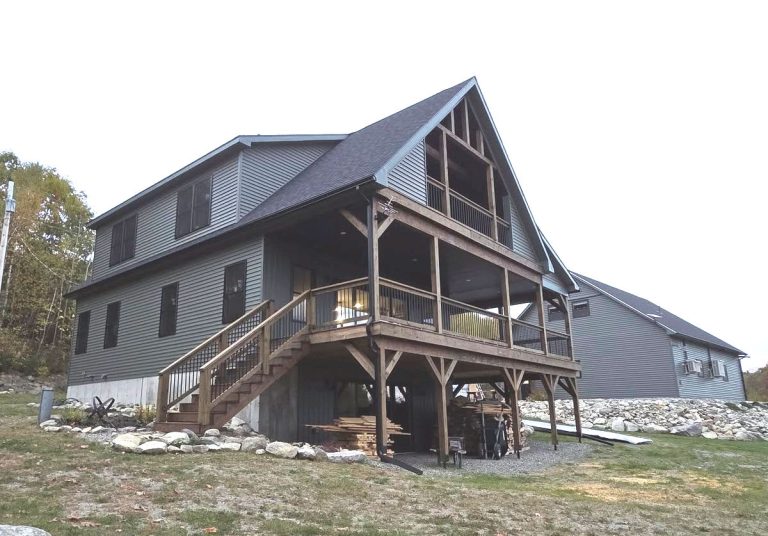 seamless rain gutters will protect house and landscaping on this house and garage