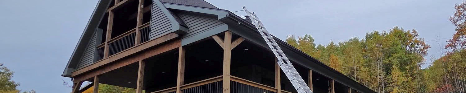 rain gutter being installed on high roof
