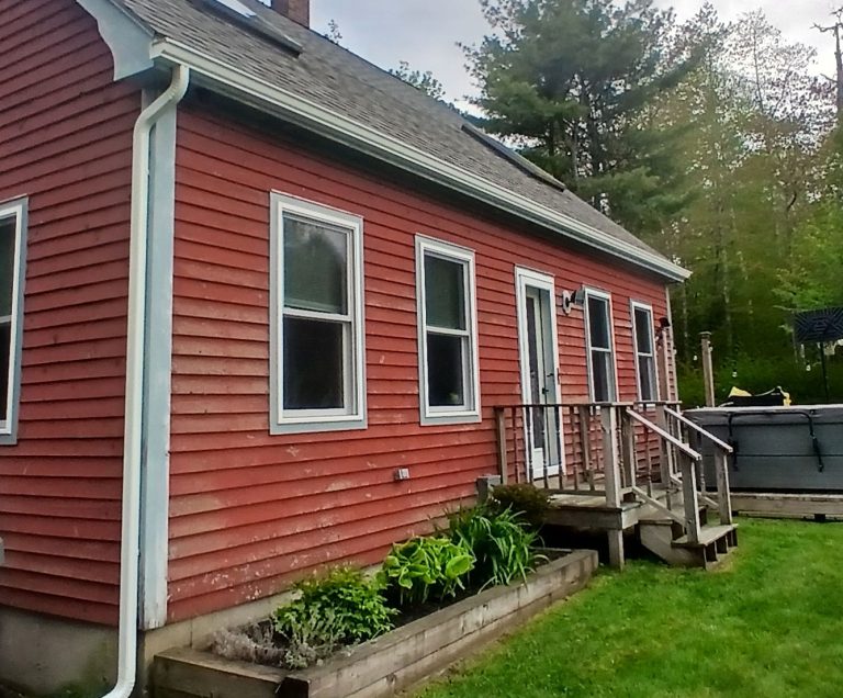 seamless rain gutters keep run off away from entrance and flower garden