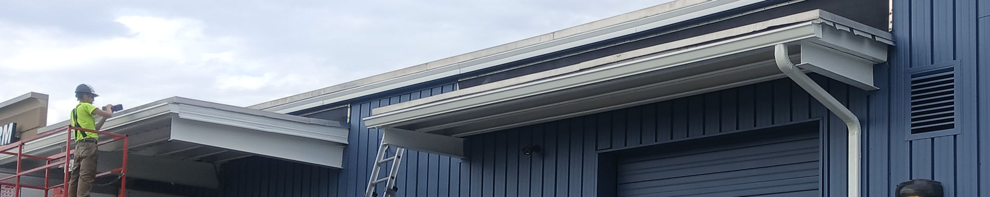 rain gutter blends in with commercial building
