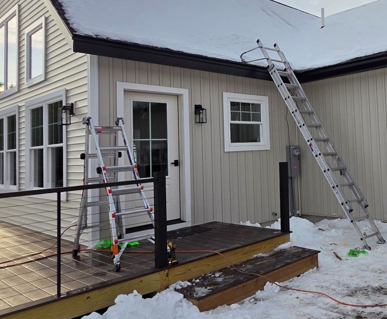 rain gutter protects wood deck and entry door