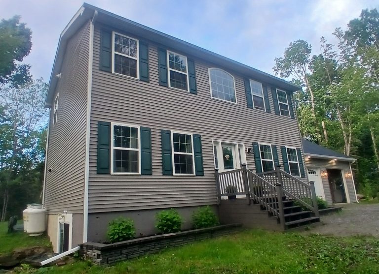 rain gutters will protect the garden and entry porch