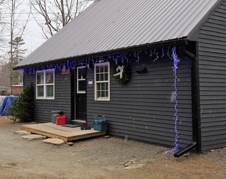black rain gutters matching house trim