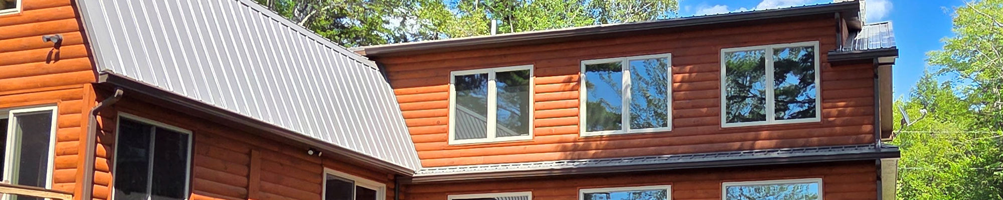 Seamless Rain Gutters on Log Home