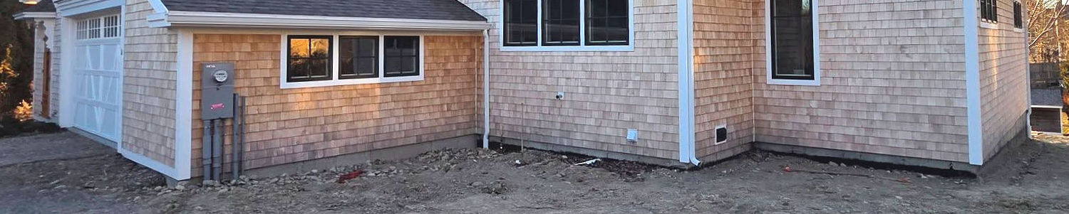 wood shingles with splash damage before rain gutters were installed