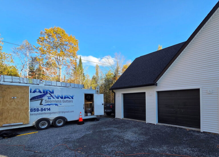 black rain gutters match garage doors